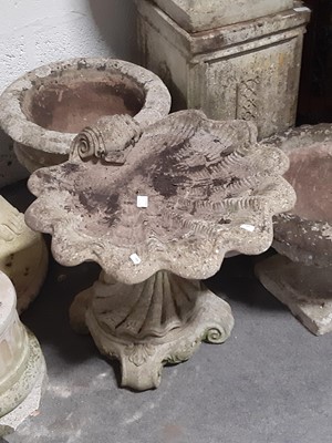 Lot 563 - Concrete pedestal planter, two similar, a rectangular plinth and a shell birdbath