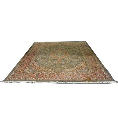 Lot 555 - A large Persian carpet.