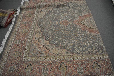 Lot 555 - A large Persian carpet.