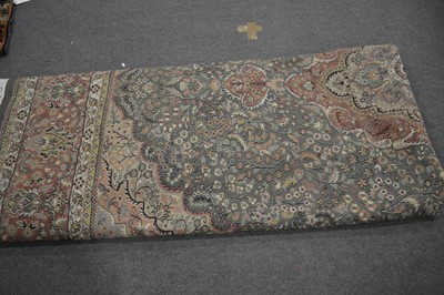 Lot 555 - A large Persian carpet.