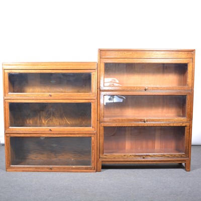 Lot 444 - Oak sectional bookcases.