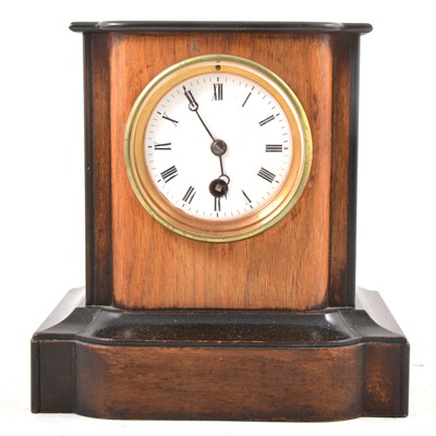 Lot 118 - A Victorian walnut and ebonised mantel clock.