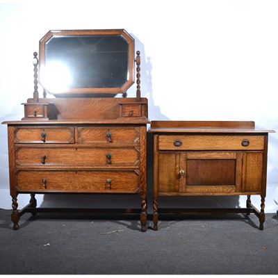 Lot 30 - An oak dressing table and similar washstand.