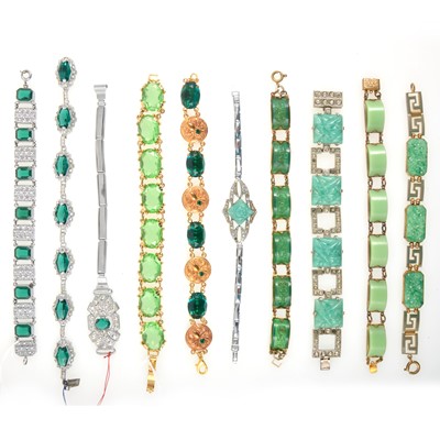 Lot 244 - Ten vintage costume jewellery bracelets set with green paste and simulated jade