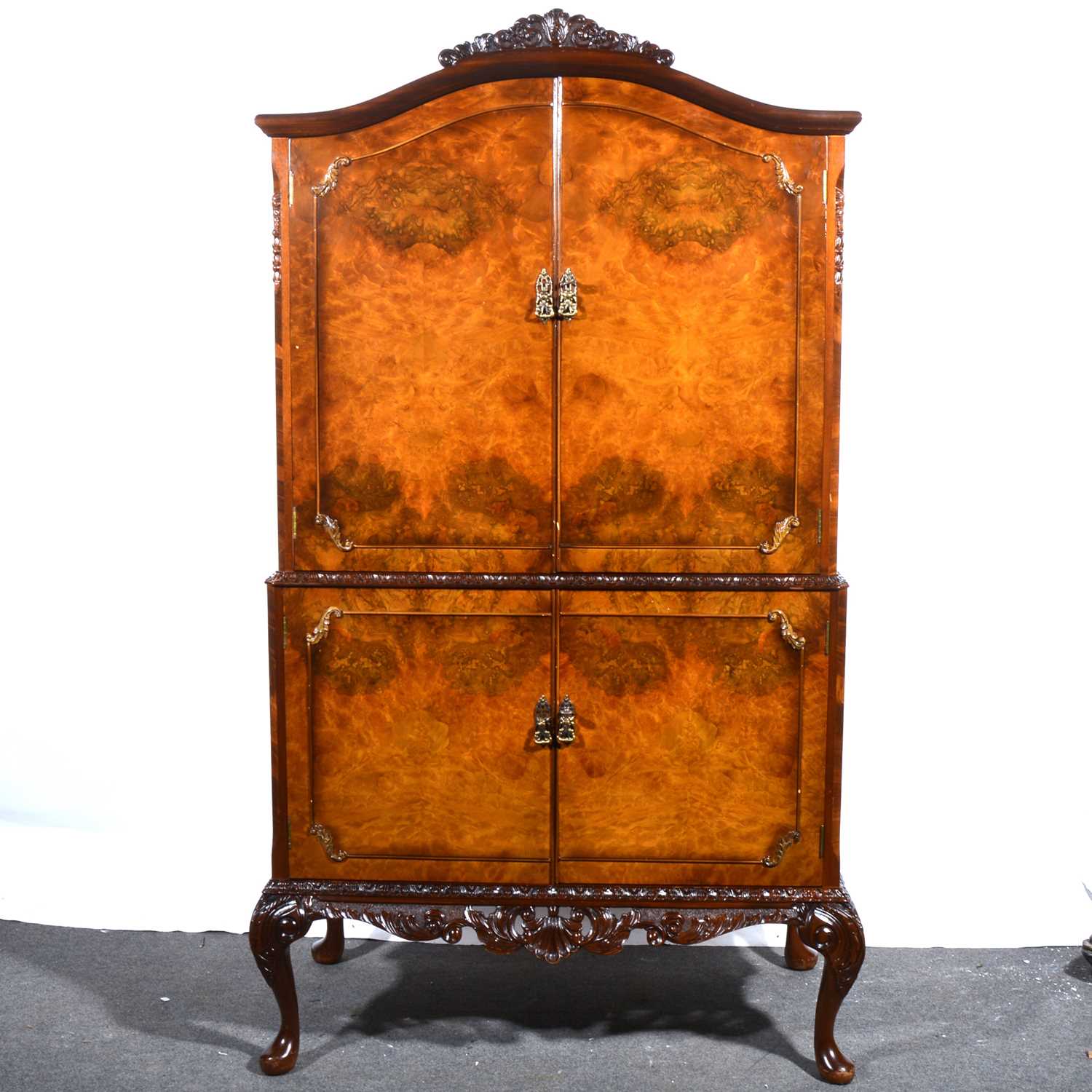 Lot 48 - A reproduction burr walnut cocktail cabinet, Queen Anne style.