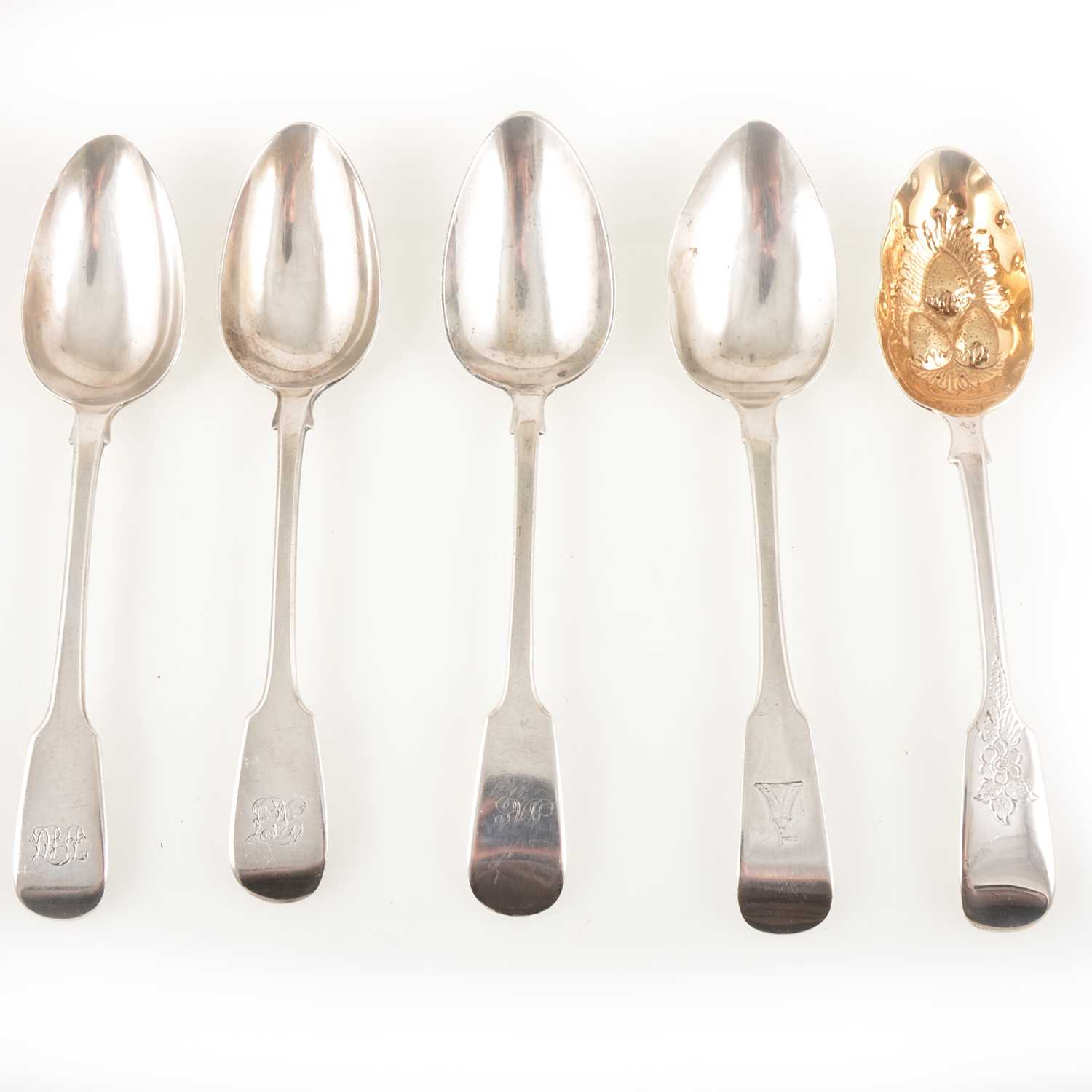 Lot 223 - Four silver table spoons and a berry spoon.