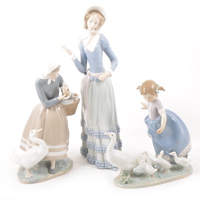 Lot 149 - Three Lladro porcelain figures, including Hurry Now, Shepherdess with Ducks, and Aranjuez Little Lady