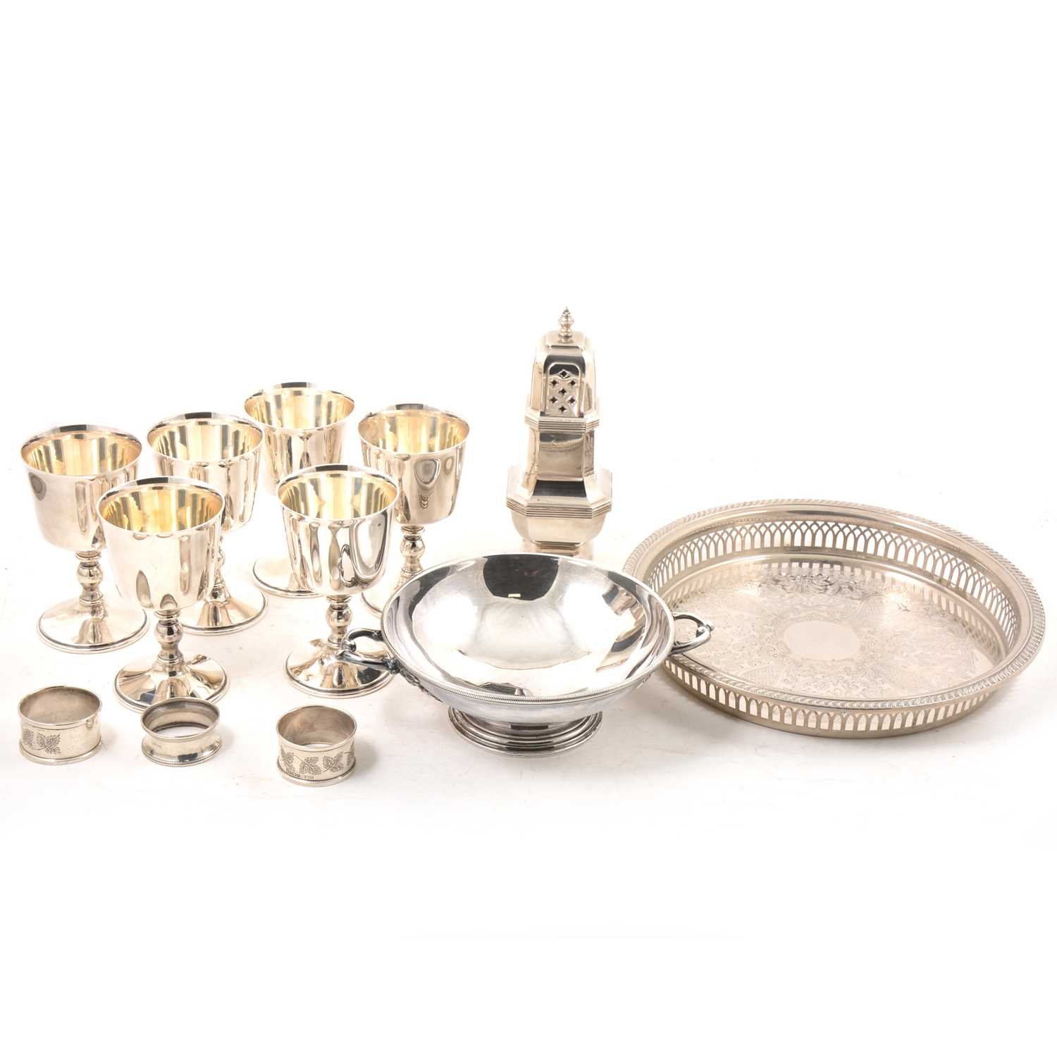 Lot 132 - A small collection of silver napkin rings and electroplated wares.