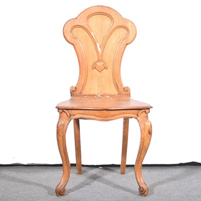 Lot 100 - A Victorian oak hall chair.