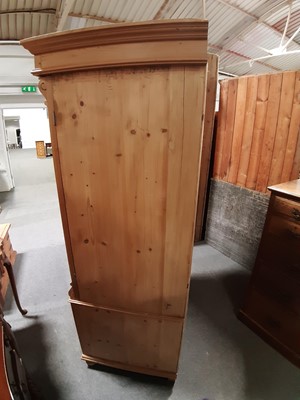 Lot 96 - A Continental pine armoire/ twin-door wardrobe.