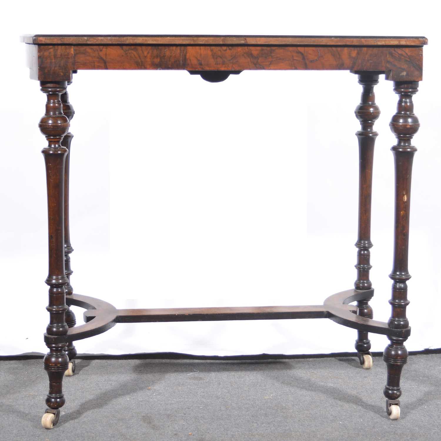 Lot 101 - A Victorian figured walnut and amboyna stretcher table.