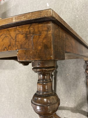 Lot 101 - A Victorian figured walnut and amboyna stretcher table.