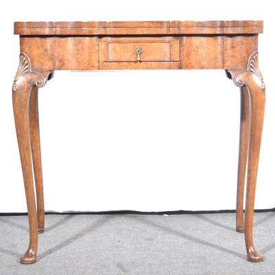 Lot 501 - A Queen Anne style burr walnut fold-over card table.