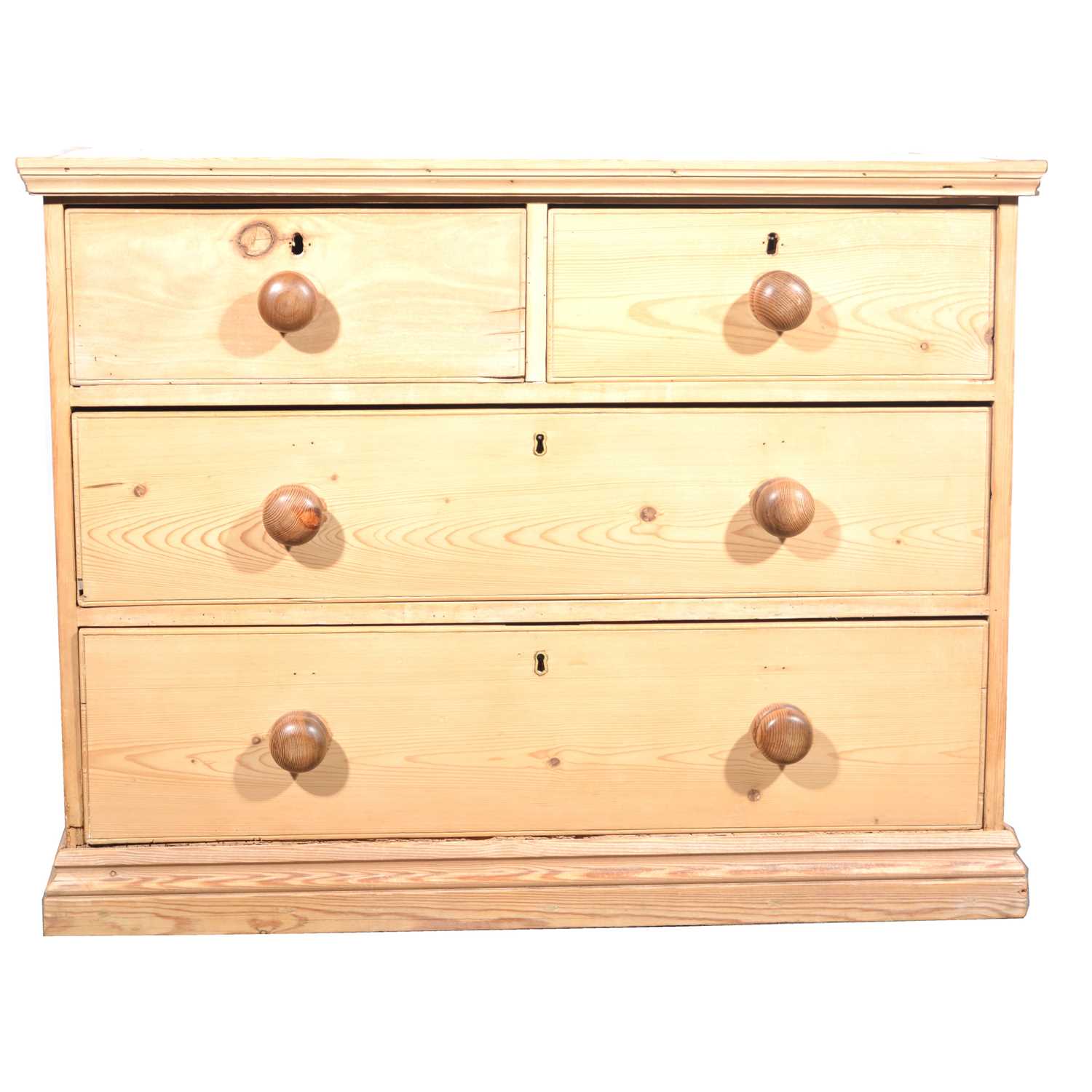 Lot 107 - A stripped pine chest of drawers.