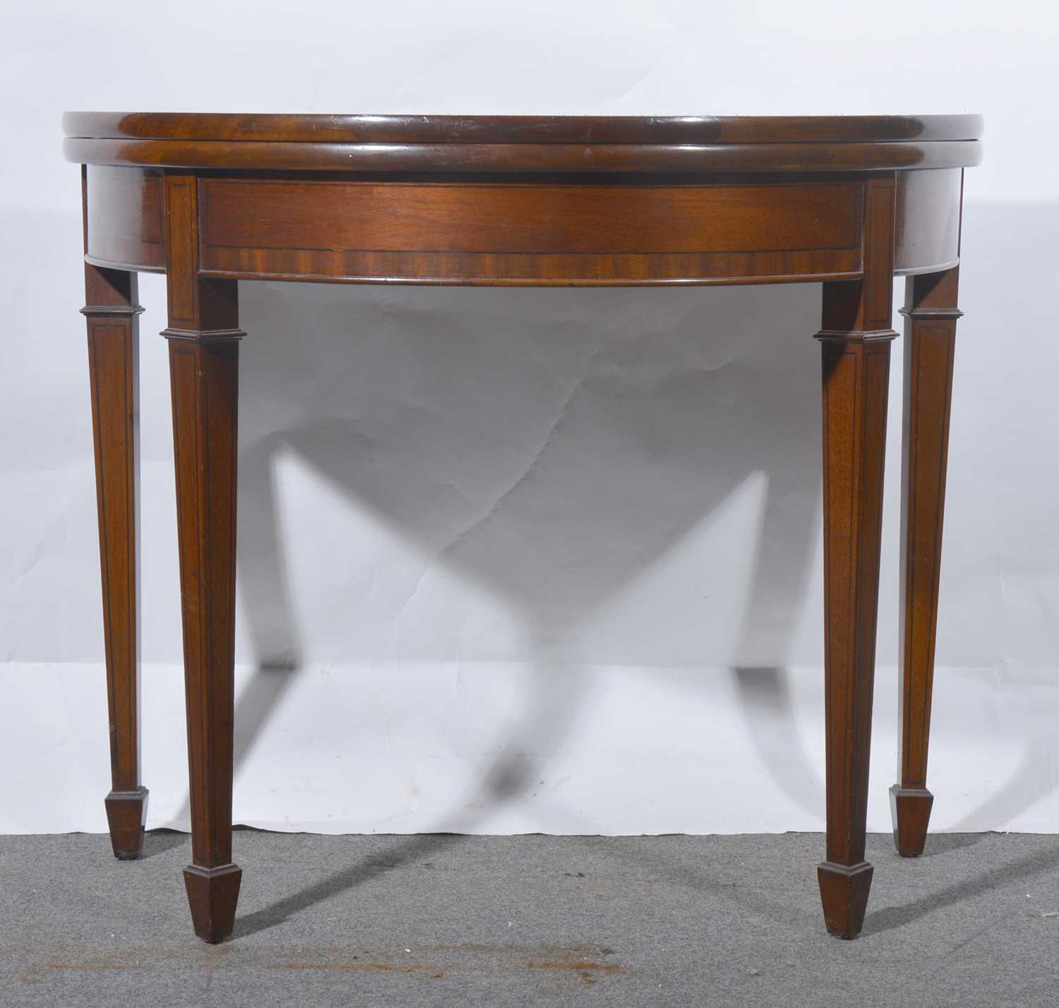 Lot 451 - Mahogany demi-lune card table