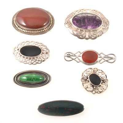 Lot 213 - Seven silver and white metal stone set brooches.