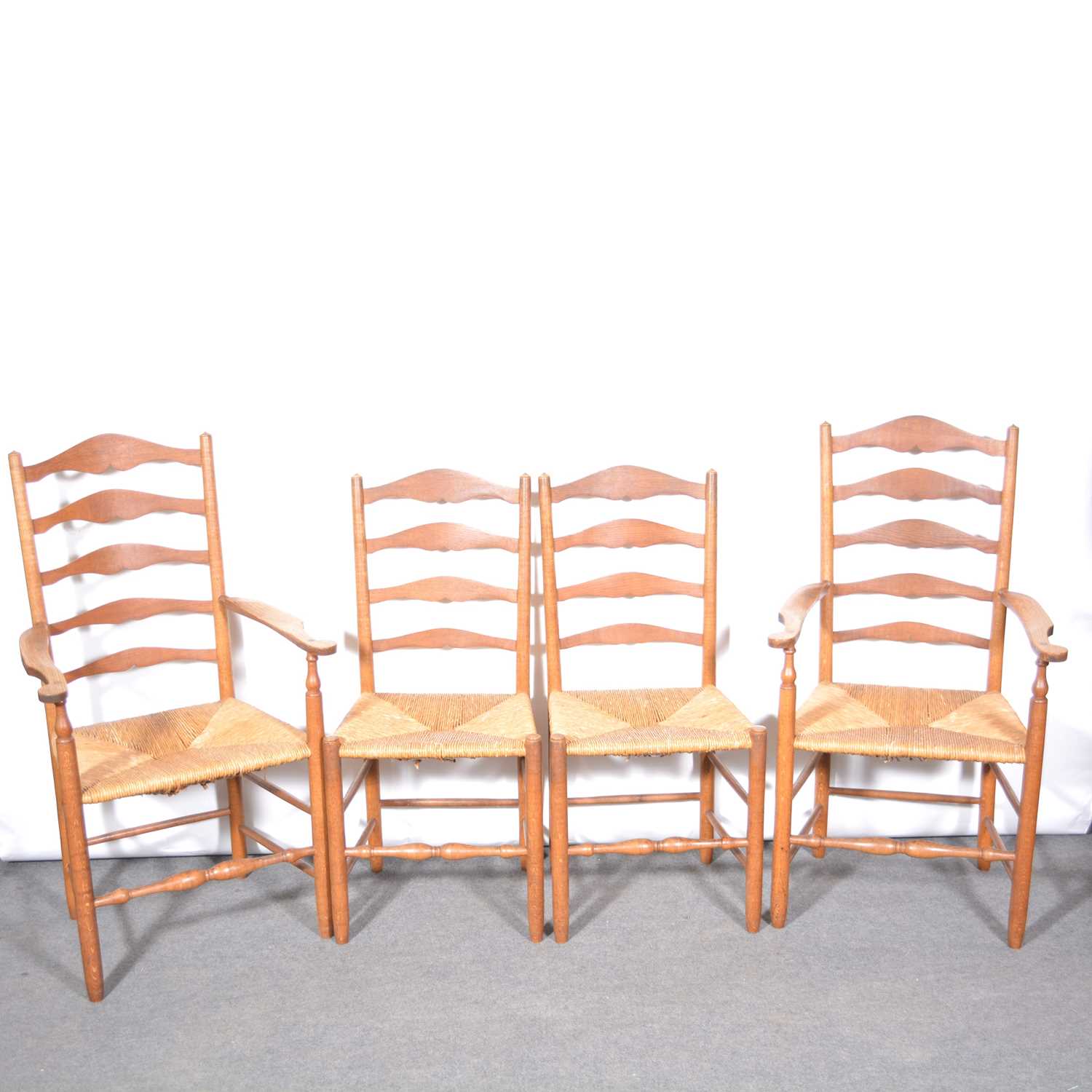 Lot 408 - Set of four ash 'Russell' ladderback dining chairs by Neville Neal, after the design by Ernest Gimson