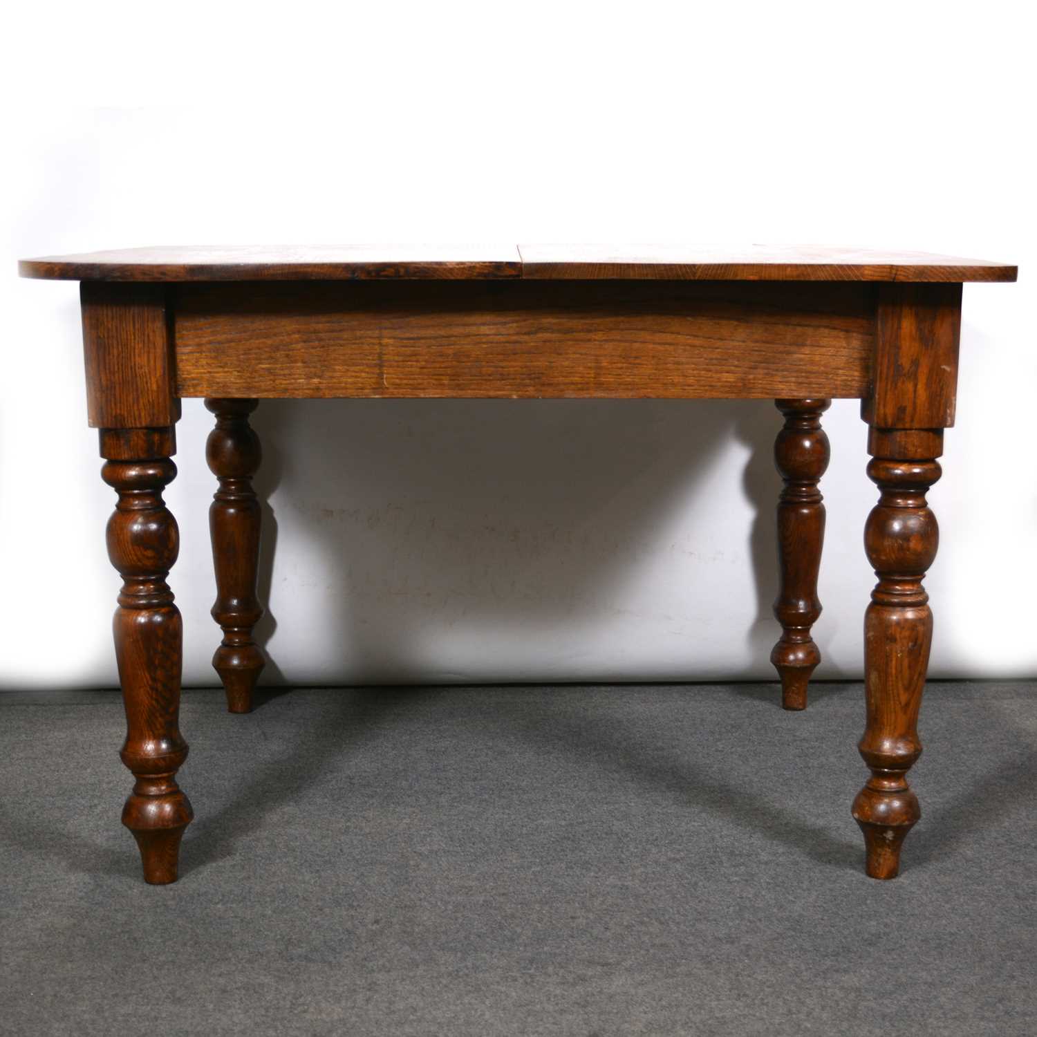 Lot 488 - Edwardian oak dining table