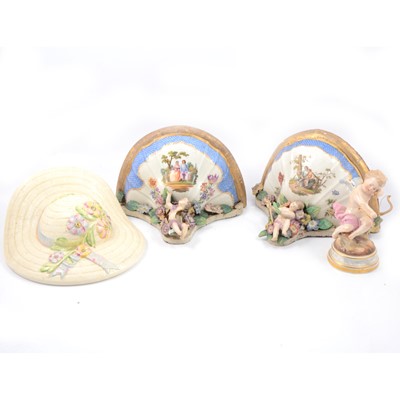 Lot 25 - Pair of Dresden porcelain brackets, a Meissen figure of Cupid and a Wedgwood wall pocket.
