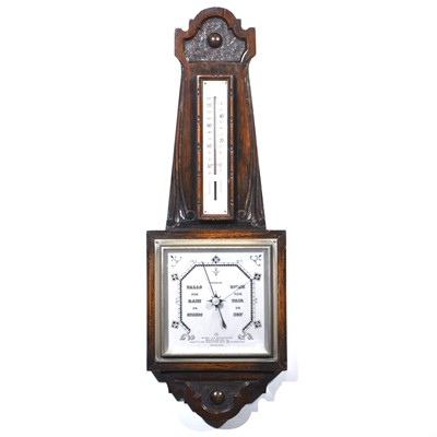 Lot 520 - British stained and carved oak cased barometer.