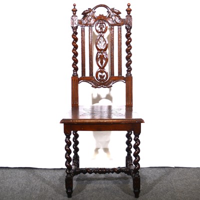 Lot 492 - A carved oak and barley twist hall chair.