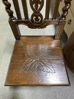 Lot 492 - A carved oak and barley twist hall chair.