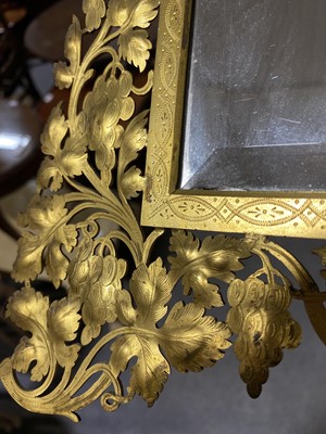 Lot 532 - A pierced gilt metal easel mirror.