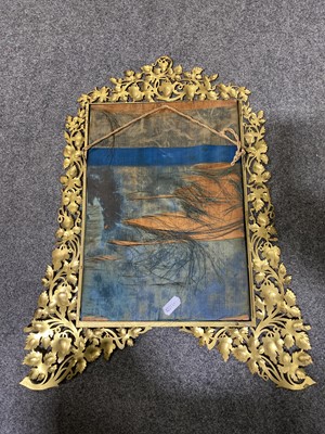 Lot 532 - A pierced gilt metal easel mirror.