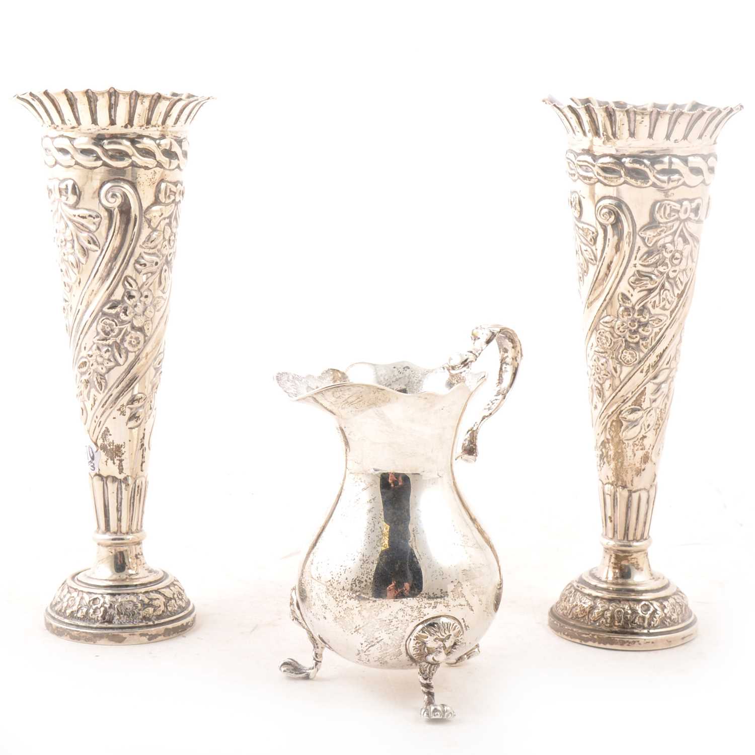 Lot 154 - Pair of Victorian silver spill vases and a silver cream  jug.