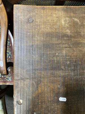 Lot 91 - A Victorian Gothic oak trestle table.
