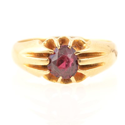 Lot 196 - A claw set garnet dress ring, marked 18ct.