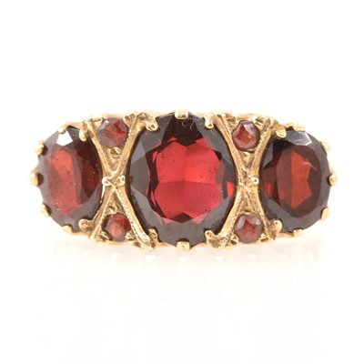 Lot 198 - Reproduction Victorian style 9 carat gold garnet dress ring