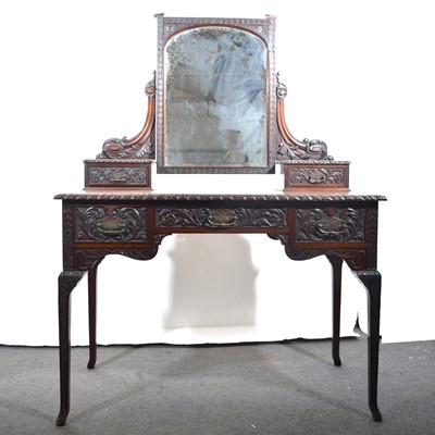 Lot 489 - A carved mahogany dressing table, by H. Mawer & Stephenson, London.