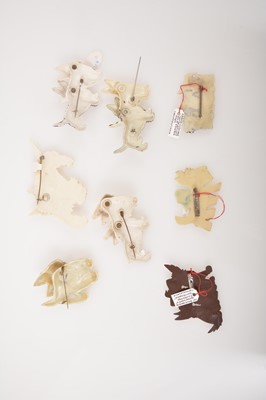 Lot 263 - Eight vintage celluloid and plastic Scottie dog brooches, five with articulated heads.