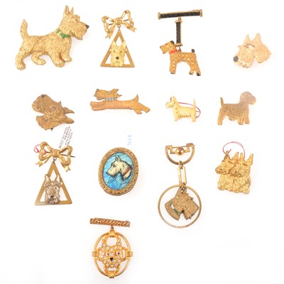 Lot 261 - One celluloid and twelve gilt metal Scottie dog brooches, 1930's and later.