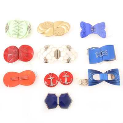 Lot 249 - Ten Art Deco pressed glass belt buckles.