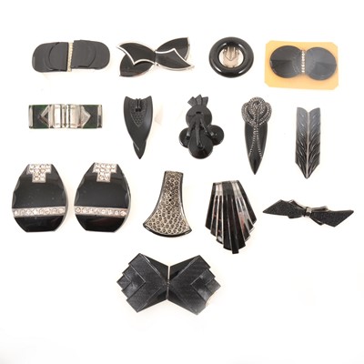 Lot 250 - Ten Art Deco black glass dress clips/brooch and five similar belt buckles.