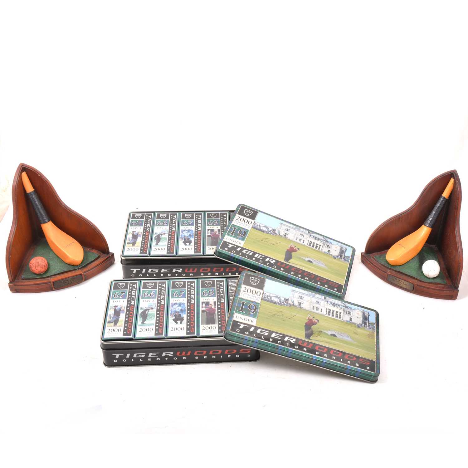 Lot 87 - A pair of triangular formed gold bookends, digital camera and golf balls.