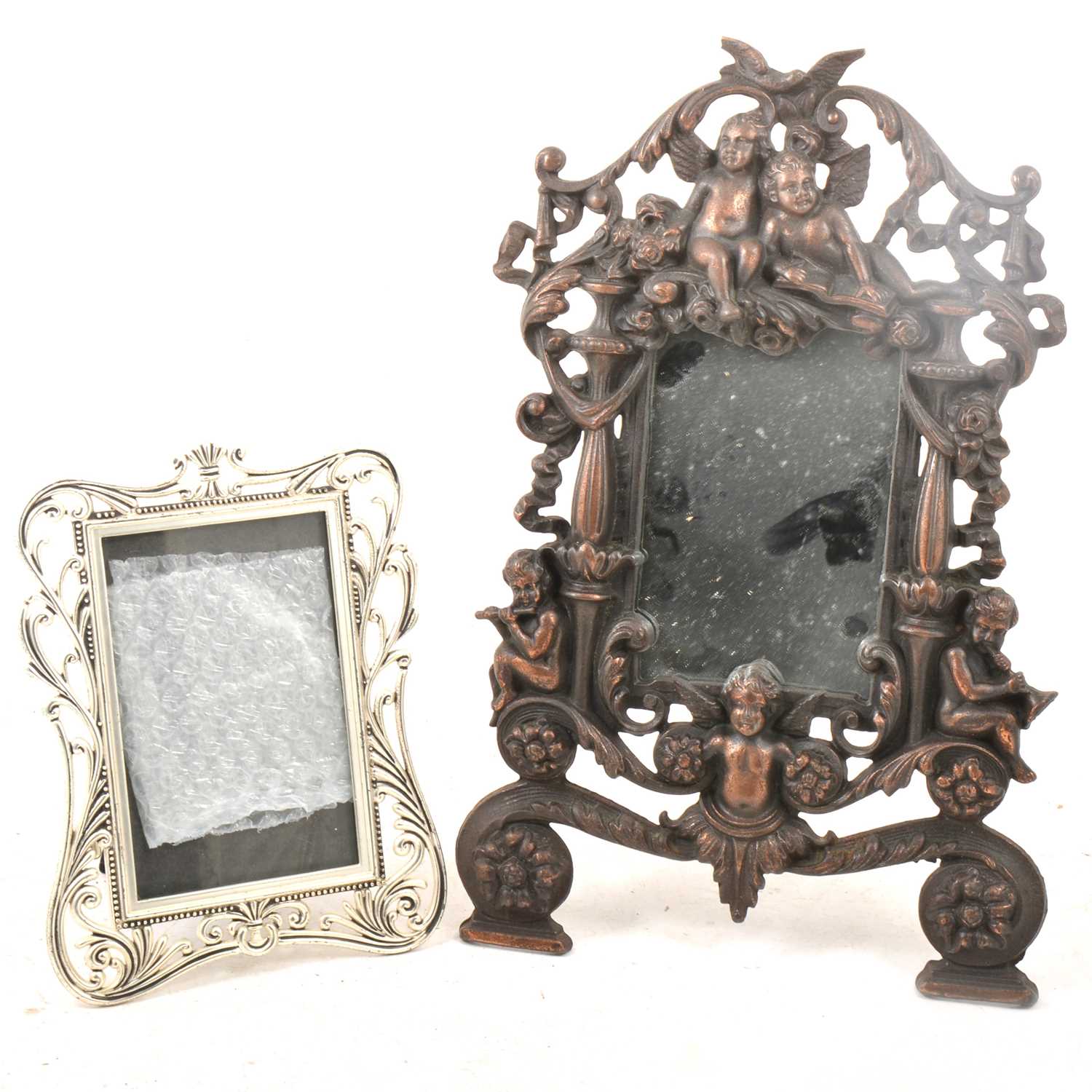 Lot 82 - Bronzed dressing table mirror and a small plated photo frame.