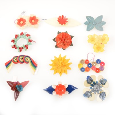 Lot 251 - Twelve wartime austerity chic celluloid floral brooches, 1940's vintage.