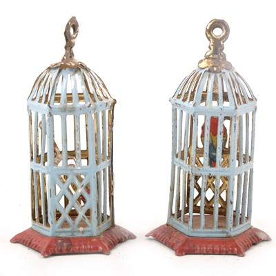 Lot 330 - A pair of 20th century tin-plate penny toys, two bird cages