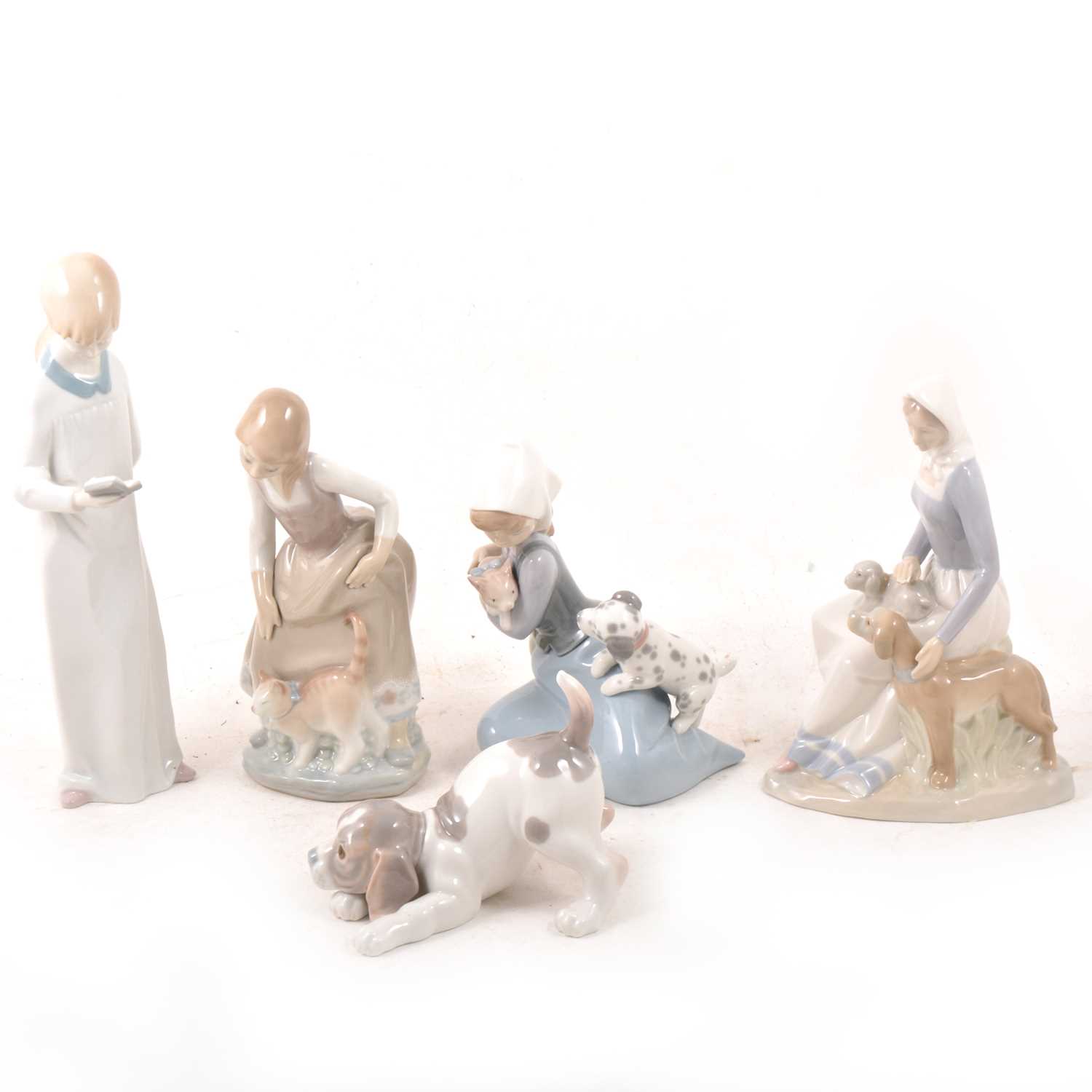 Lot 10 - Four Lladro figures and another figure.
