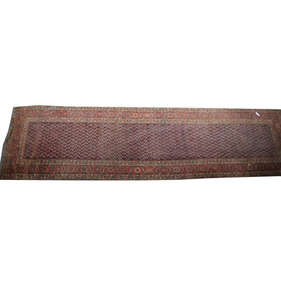 Lot 543 - A Persian runner.