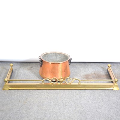 Lot 266 - Edwardian brass fender, 135cm and a copper bucket.