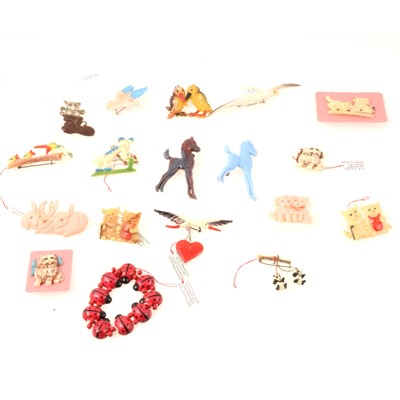 Lot 252 - Eighteen novelty celluloid, plastics children's themed costume jewellery, 1930's-1950's