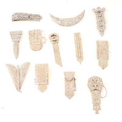 Lot 236 - Twelve large Art Deco paste set dress clips.