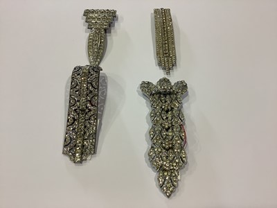 Lot 236 - Twelve large Art Deco paste set dress clips.