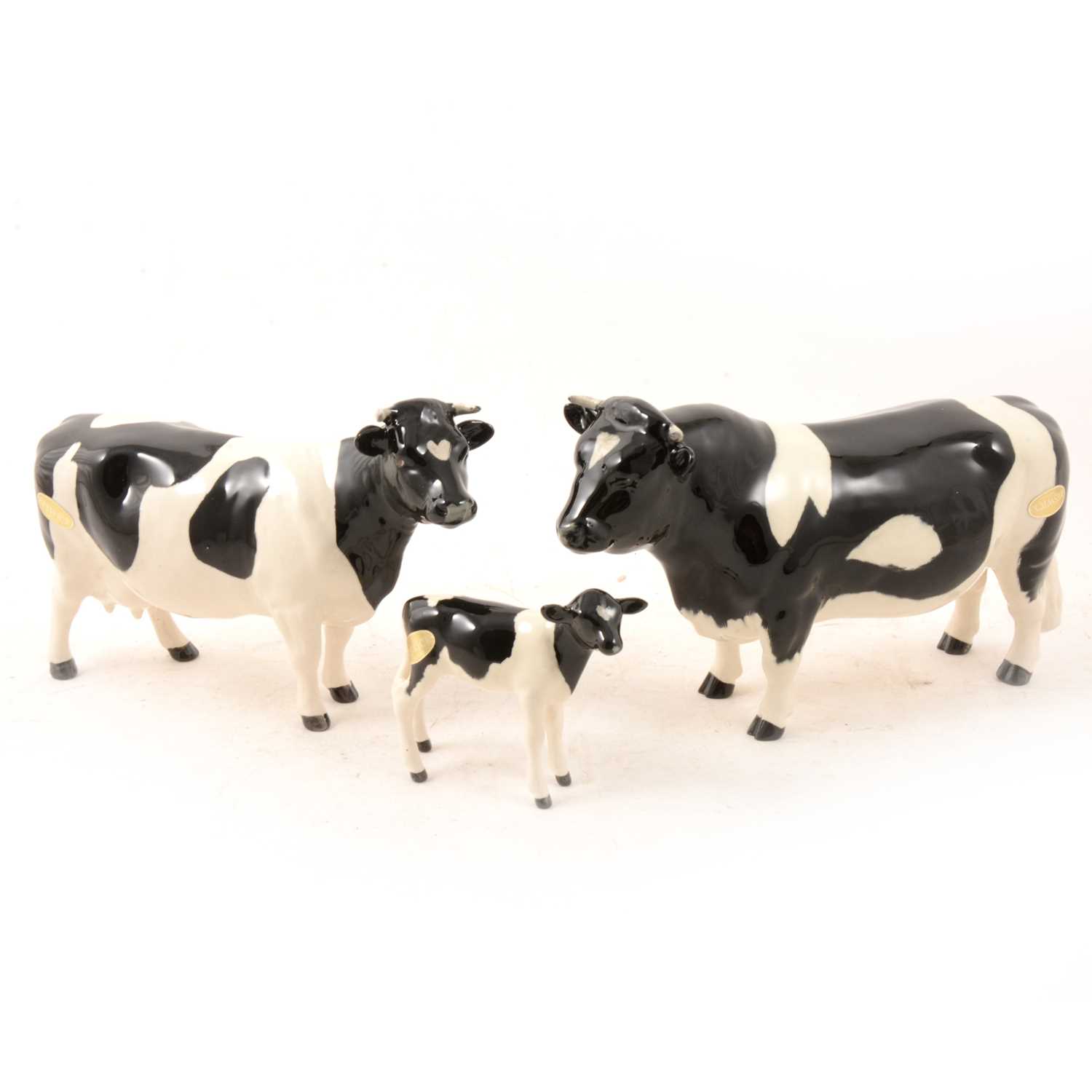 Lot 6 - A Beswick Friesan Bull "Ch. Coddington Hilt Bar", Cow and Calf models.