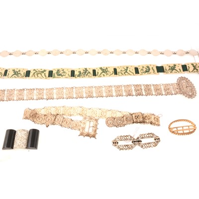 Lot 277 - Four vintage belts, one by Y.A. Leroy Paris  and three paste set buckles.