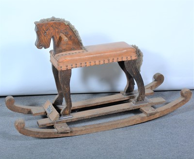 Lot 150 - An early 20th century oak and stained pine child's rocking horse